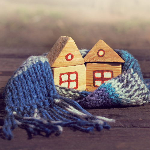 Image of a house wrapped in a warm scarf, for top tips on preparing your home for winter