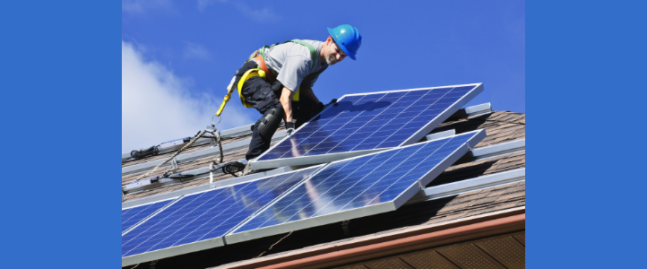 Photo of solar PV being installed on a house