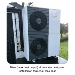 Image of 10kw (peak heat output) air source heat pump installed on former oil tank base