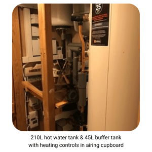Image of 210L hot water tank & 45L buffer tank with heating controls in airing cupboard